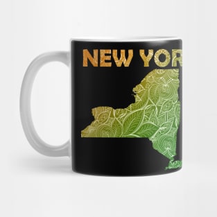 Colorful mandala art map of New York with text in green and orange Mug